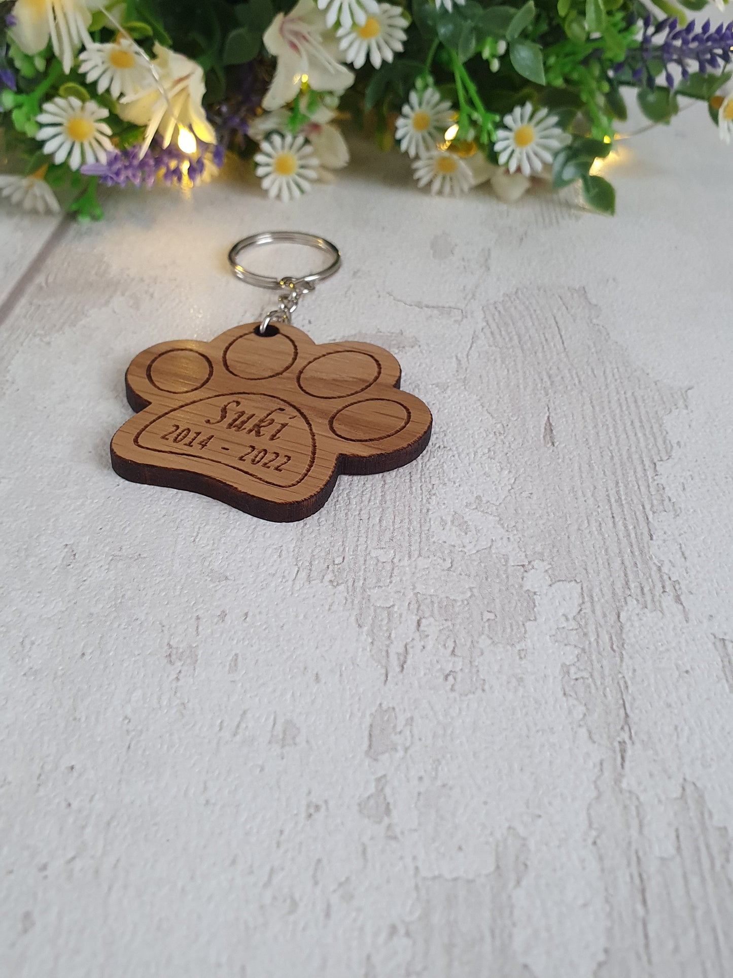 Personalised cat paw print keyring.