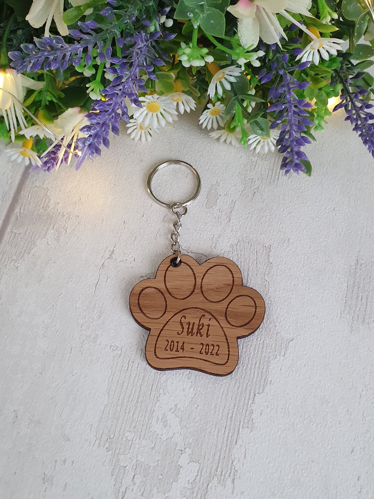 Personalised cat paw print keyring.